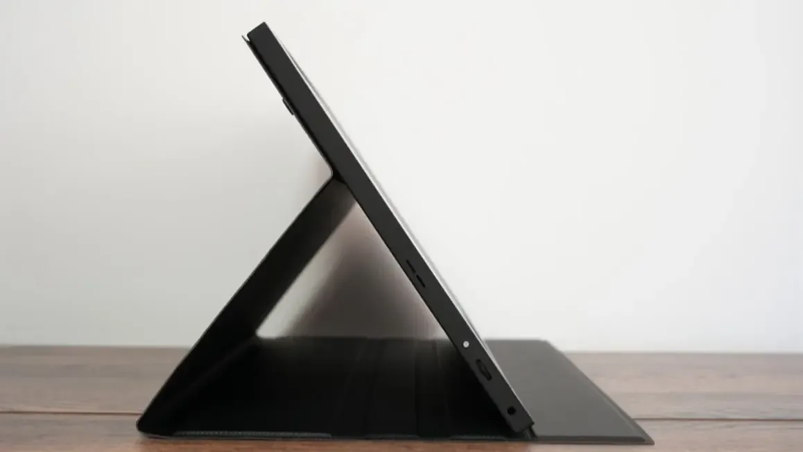 Side profile of the portable monitor on its foldable cover stand